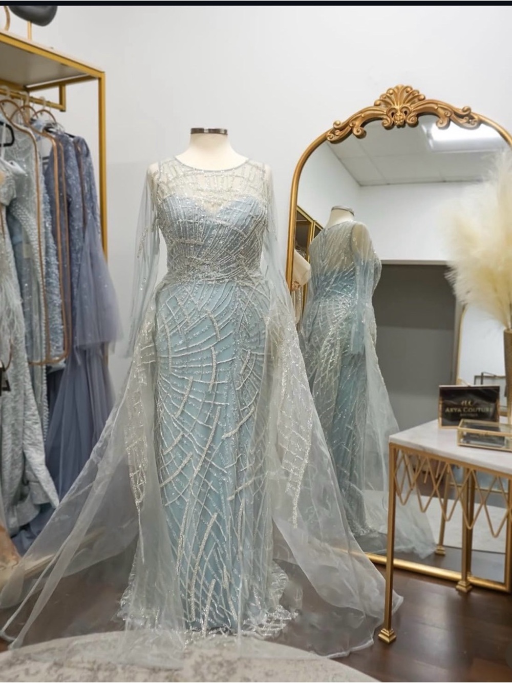 Elegant Ice Blue Beaded Evening Gown with Sheer Cape